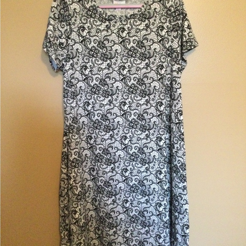 Like new Lularoe Carly Dress, size Medium. White background, black lace …